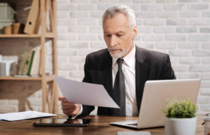 man assessing documents